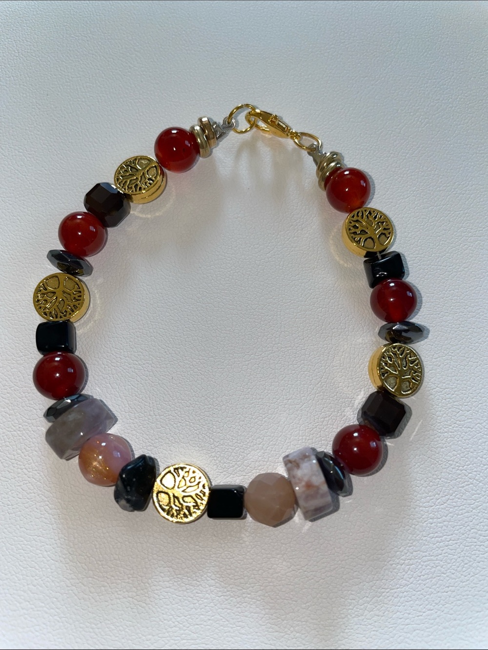 Red Jasper with Tree of Life charms and hematite & pink quartz stones.